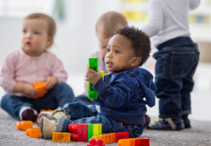 Montessori student using a Montessori movable alphabet to build early literacy skills.