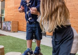 Child using Montessori globe materials to explore geography in a tactile way.